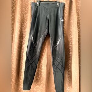 CW-X Women's Stabilyx Joint Support Compression Leggings in a sleek black color.